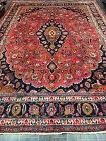 Full view of rug showing central medallion and borders