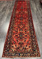 Full view of the 12’3” x 3’5” hand-knotted Persian runner rug