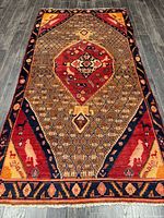 Full view of the Hamadan rug showing entire pattern and borders