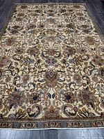 Full view of Persian Tabriz rug showing entire pattern and borders