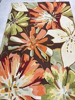 Full view of the multicolor floral area rug