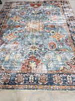 Full view of rug showing pattern and colours