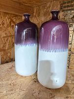 Pair of purple to white ombré glazed ceramic vases on shelf