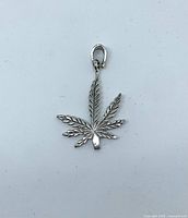 Front view of sterling silver cannabis leaf pendant