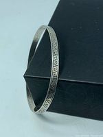 Full view of sterling silver bangle showing Greek key pattern