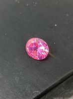 Front view of oval pink faceted gemstone