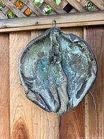Front view of the stoneware wall sculpture showing colors, texture, and hanging loop