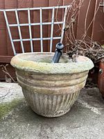 Front view of the single concrete planter showing full design