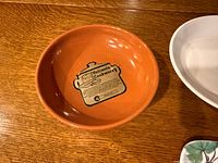 Round glazed terracotta dish with Vulcania label