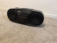 Front view of Samsung portable stereo showing speakers, cassette deck, control panel and overall condition