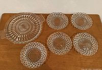 Top view showing handled platter and five bread plates