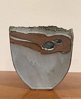 Front view showing overall shape, glaze, abstract band