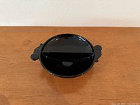 Top view of black divided bowl showing interior divider