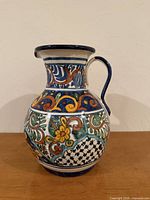 Front view of colorful hand-painted ceramic jug