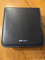 Closed black cdProjects binder front view