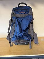 Front view of rolling duffel showing main compartment and straps