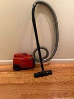 Full view of vacuum with hose and wand