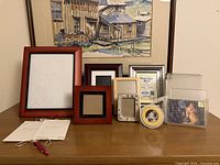 All frames arranged on tabletop showing sizes and materials