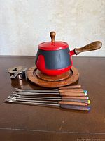 Fondue pot, burner, stand and six forks arranged together