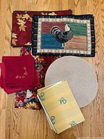 Overall view of assorted placemats, napkins and linen pieces