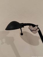 Close-up of lamp shade and gooseneck joint