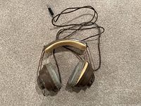 Full view of Koss SP/3 headphones showing ear cups, headband, cord and plug