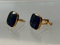Front view showing lapis lazuli inlay and gold frames