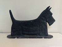 Full view of cast iron Scottish Terrier doorstop front-left side