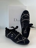 Sneakers displayed with original Dior box