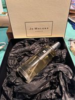 Jo Malone Pomegranate Noir room spray bottle in gift box