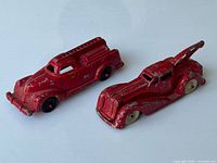 Both Manoil diecast fire trucks side by side showing size and paint wear