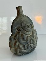 Front view showing figure, corn relief and spout