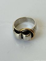 Front view of two-tone Hermès ring