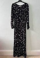 Full view of the dress hanging to show overall style and length