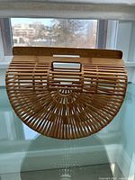 Front view of semicircular bamboo handbag