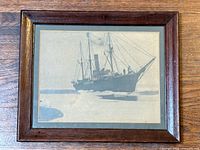 Full view of framed photograph showing ship S.S. Neptune in ice