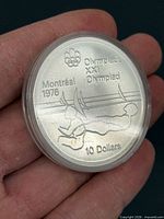 Close-up of reverse of 1976 Montreal Olympic $10 silver coin in plastic capsule