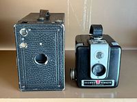 Front view of Kodak No.2A Box Brownie and Brownie Hawkeye cameras side-by-side