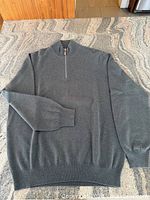 Front view of cashmere half-zip sweater laid flat