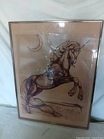 Full view of framed unicorn artwork