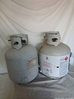 Front view of both 5-gallon propane tanks