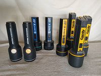 All eight flashlights upright showing brands and styles