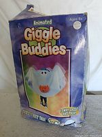 Front of original Giggle Buddies box showing product details