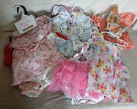 Group of six infant garments laid out