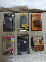 All six retail-packaged accessories arranged on surface