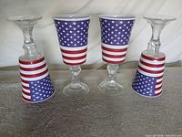 Four patriotic goblets, two upright two inverted