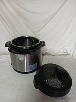 Cooker base with lid removed showing stainless exterior and interior