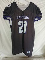 Full view of black side of jersey hanging