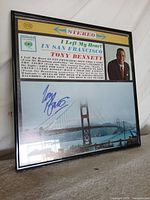 Overall view of framed signed Tony Bennett poster
