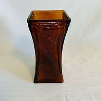 Front view of amber square tapered glass vase